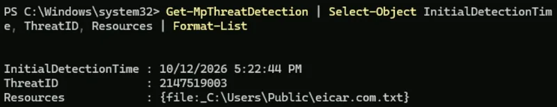 PowerShell output of Get-MpThreatDetection on the lab VM showing an EICAR test file detection at C:\Users\Public\eicar.com.txt on October 12 2026